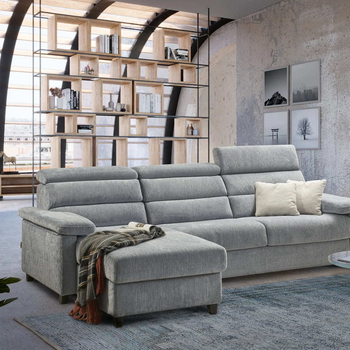 Divano letto Poseidone in tessuto blu in soggiorno