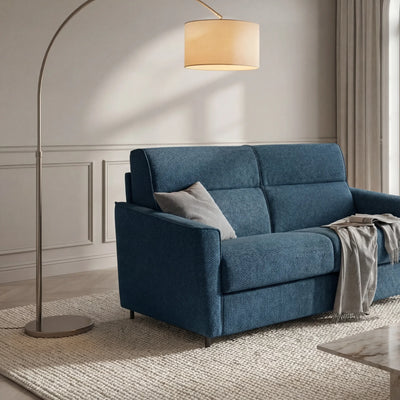 Divano letto Cronos in tessuto blu in soggiorno